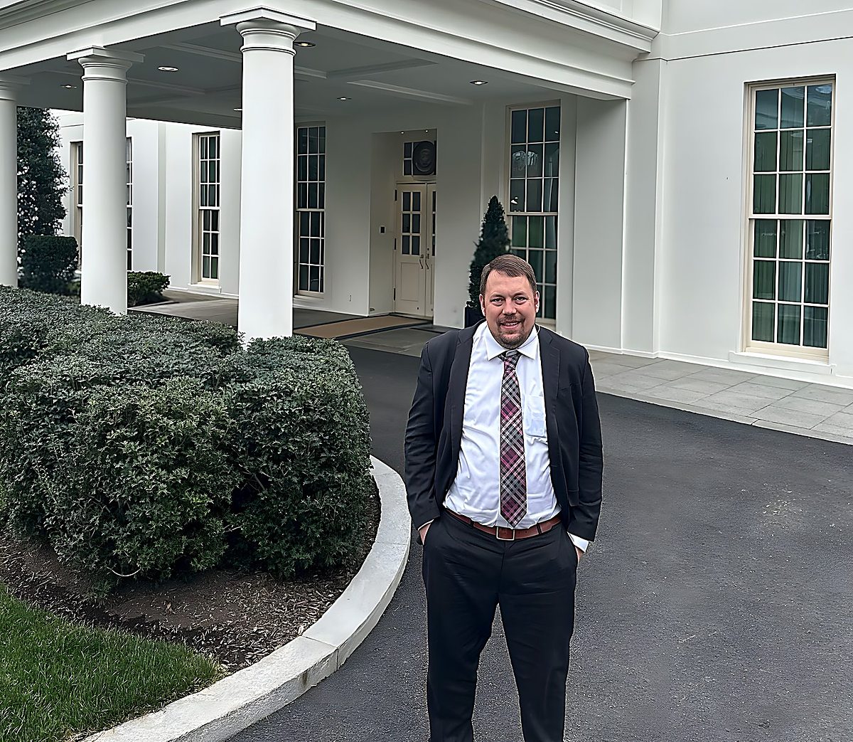 Gregg Roman standing on the driveway at the West Wing entrance of the White House